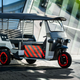 A photo of the Audi-branded rickshaw, which is painted gray with red details.